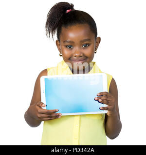 Close up portrait of cute little african girl with ponytail holding blank digital tablet.Isolated on white background. Stock Photo