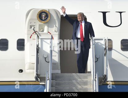 Columbus, Ohio, USA. 4th Aug, 2018. President Donald Trump waves at the crowd as he emerges from Air Force One after landing at Columbus International Airport in Columbus, Ohio. Trump made a visit to Ohio to speak at a rally in support of Republican candidate Troy Balderson. Balderson will face off against democrat Danny O'Connor in the August 7th election for Ohio's 12th Congressional District. A tight race, the rally and appearance by President Trump is an effort to try and solidify the Republican's hold in the region. Credit: Matthew Hatcher/SOPA Images/ZUMA Wire/Alamy Live News Stock Photo