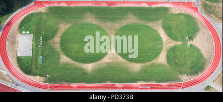 Bad Buchau, Germany. 06th Aug, 2018. The sports field of SV Bad Buchau is irrigated in a circular pattern. Due to the continuous drought, the lawn only grows where the water is sprinkled. Credit: Thomas Warnack/dpa/Alamy Live News Stock Photo