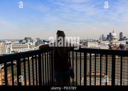 London UK. 6 August  2018. A visitor admires the view of London city skyline and financial district from the 10th floor viewpoint at Tate Modern on another hot day as temperatures are expected to exceed 30C Credit: amer ghazzal/Alamy Live News Stock Photo
