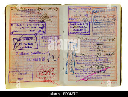 1935's vintage French passport, pages with 1936 German and Austrian visas stamps marks, Stock Photo