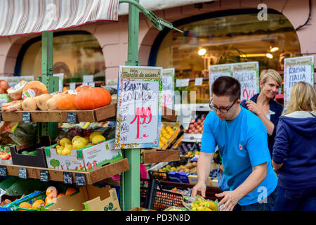 Shop assistant at grocery fruits stall, Strasbourg, Alsace, France, Europe, Stock Photo