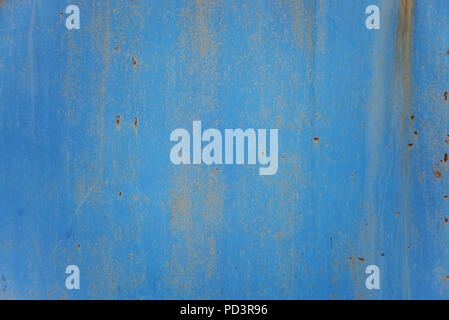 Blue abstract background: rusty metal surface with blue paint flaking and cracking texture Stock Photo