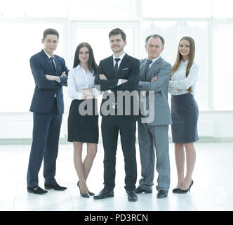 in full growth. business team standing near the office window Stock ...
