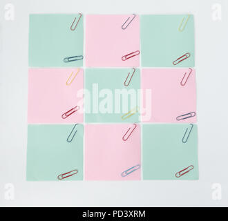 multiple blank sheets for notes with paper clips isolated on whi Stock Photo