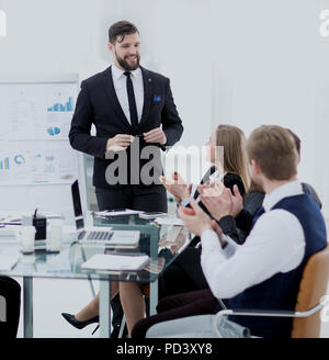 colleagues applaud the project Manager after the working meeting Stock Photo