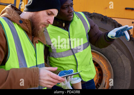 Two Miners using Tablet Stock Photo