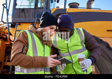 Miners Using Tablet on Site Stock Photo