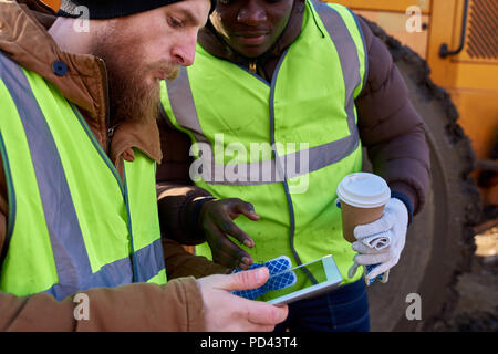 Miners Using Digital Tablet Stock Photo