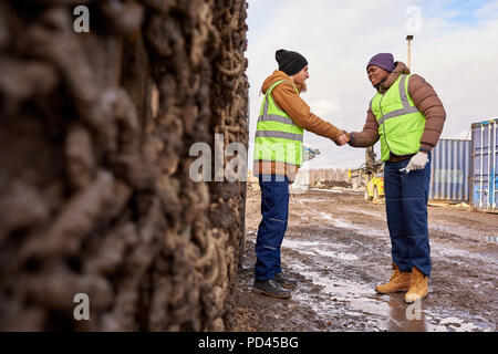 Two  Workers Shaking Hands Stock Photo