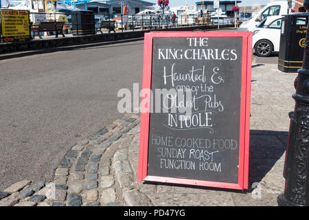 Notice Board advertising The King Charles pub in Poole, Dorset, UK Stock Photo