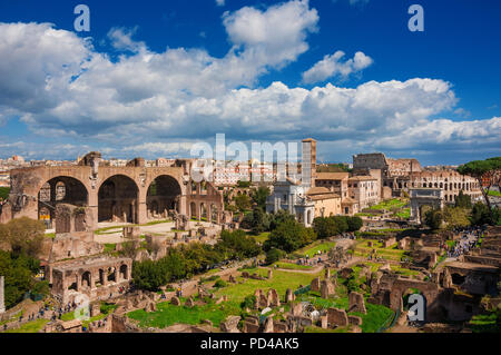 Sightseeing in Rome. Tourists visit Roman Forum ancient ruins Stock Photo