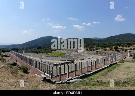 The Gymnasium and Stadium complex at Ancient Messene. Peloponnese. Greece. The horse shoe-shaped end of the Stadium includes 18 tiers of seats with 18 Stock Photo