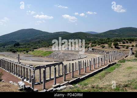 The Gymnasium and Stadium complex at Ancient Messene. Peloponnese. Greece. The horse shoe-shaped end of the Stadium includes 18 tiers of seats with 18 Stock Photo