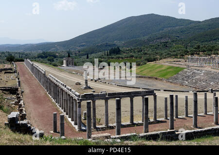 The Gymnasium and Stadium complex at Ancient Messene. Peloponnese. Greece. The horse shoe-shaped end of the Stadium includes 18 tiers of seats with 18 Stock Photo