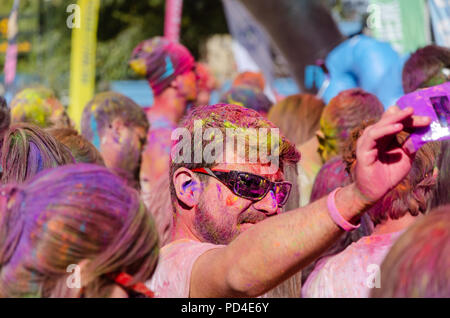ESKİSEHİR,TURKEY-OCTOBER 1,2016: Man is taking selfie after Colorsky 5k run in the crowd. Stock Photo