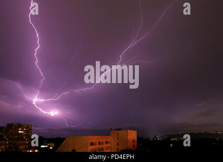 beautiful powerful lightning strikes over the sea and city, Varna. Bulgaria Stock Photo