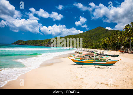 Traditional boats on Sabang beach, Puerto Princesa, Palawan island. Philippines . Stock Photo