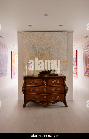 Antique drawers and paintings in hallway Stock Photo