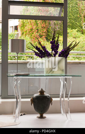 Flower arrangement in vase on table
