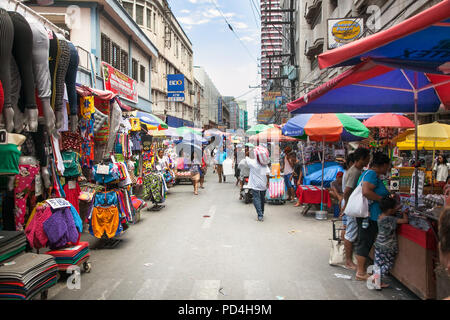 MANILA, PHILIPPINES - APR 1, 2016. People at street market in Manila on Apr 1, 2016,  Philippines. Manila is the capital of Philippines and the most d Stock Photo