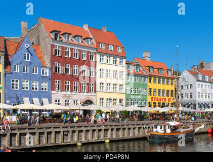 Historic buildings along Nyhavn canal, Copenhagen, Denmark. The oldest house is no 9 on the far left (blue building), Copenhagen, Denmark Stock Photo