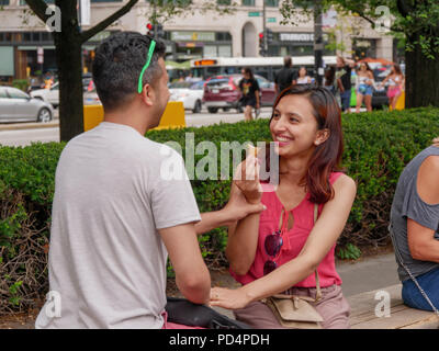 A young couple having fun at Chicago's Millennium Park. Stock Photo