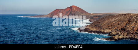 Panorama landscape of unique lava's caves Los Hervideros and ocean in Lanzarote island. Volcanic beach. Nature background. Canary Islands. Spain Stock Photo