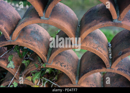 old terracotta wall installation in garden artistic design Stock Photo