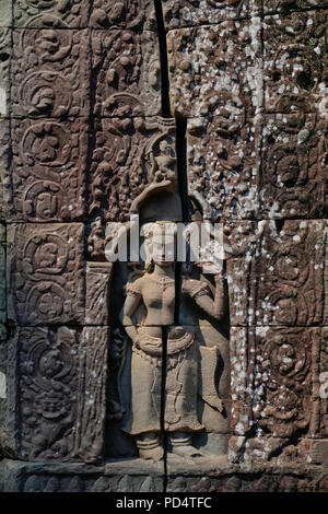 Apsara dancers in laterite wall, Ta Som temple in Angkor, Cambodia. Stock Photo