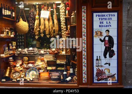 Window of shop selling typical Spanish hams (jamon serrano) and local produce, Toledo, Castile-La Mancha, Spain Stock Photo