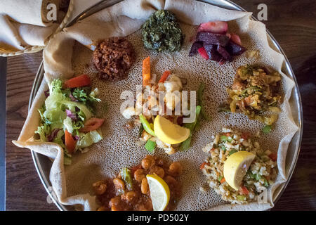 African food.  Injera is a sourdough flatbread made from teff flour.  It is the national dish of Ethiopia, Eritrea, Somalia and Djibouti Stock Photo