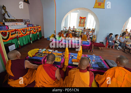 Tibetan monks during the service for the pilgrims in the Khosheutovsky temple (khurul)  - the oldest Kalmyk’s buddhistic temple in Europe. Stock Photo