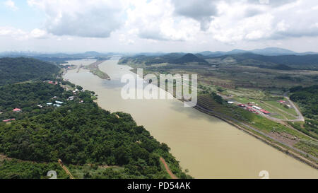 Aerial view of The Panama Canal looking West towards the Miraflores Lock and the new expansion Cocoli Lock and Panama City on the Background Stock Photo