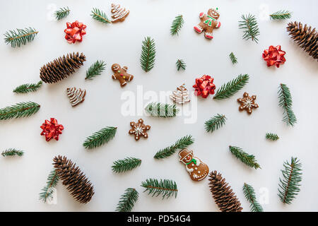 Christmas or New Year background. Many different items lie on the surface including traditional gingerbread cookies. Stock Photo