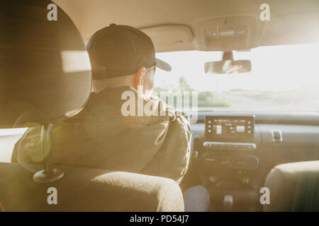 The driver or traveler or tourist is driving a car. Everyday riding or traveling. Stock Photo