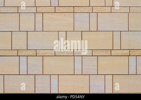 Beautiful modern beige stone tile wall has the look of stained glass and marble with its geometric design Stock Photo
