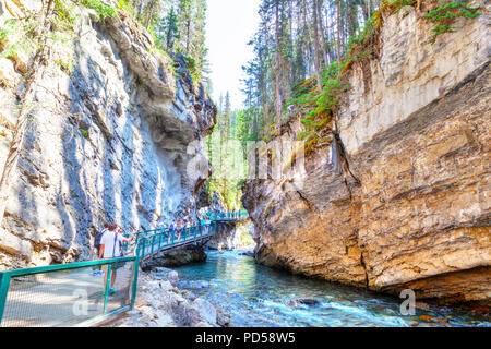 BANFF, CANADA - JUL 30, 2018: Visitors sightseeing at Johnston Canyon of Banff National Park, a popular hiking trail through the walkway on the limest Stock Photo