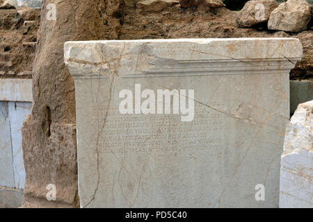 Ancient Greek inscribed base for a statute of a young female initiate named Mego. Ancient Messene. Peloponnese. The base is in a room divided in three Stock Photo