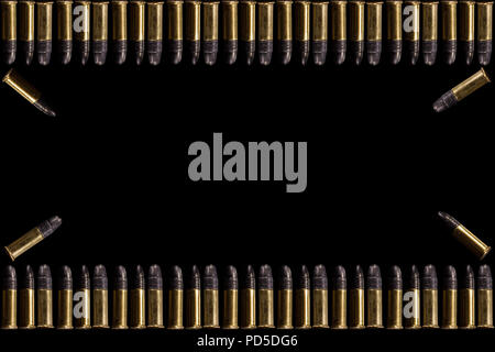 Bullets and shell bullets on white background. A group of 9mm bullets for a gun isolated on black background. Ammunition on white background. a rectan Stock Photo