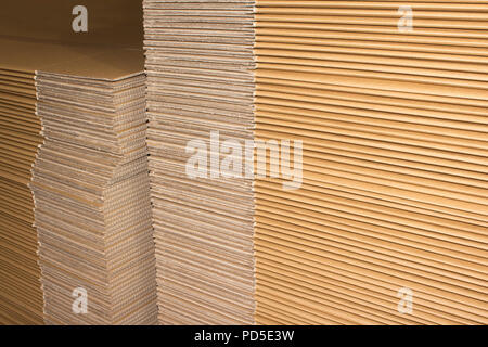 Stack of flat industrial folding cardboard packaging boxes Stock Photo
