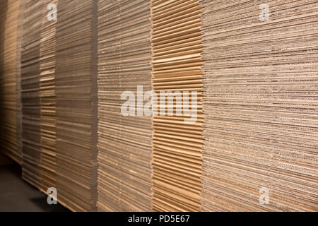 Stack of flat industrial folding cardboard packaging boxes Stock Photo