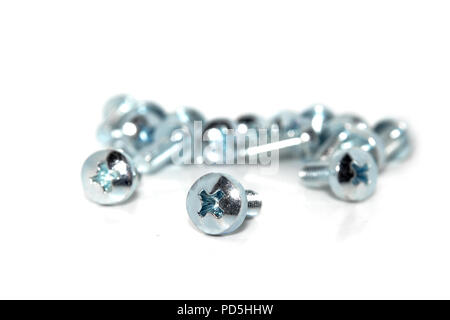 A few isolated galvanized industrial steel screw on white background Stock Photo