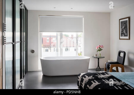 Bath tub in minimal bedroom Stock Photo
