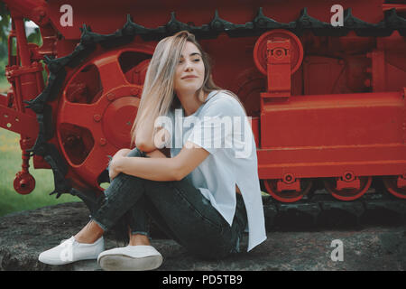 Woman and heavy metal machine Stock Photo