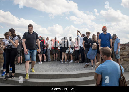 Tourists looking out over the city from Prague Castle in Prague, Czech Republic Stock Photo