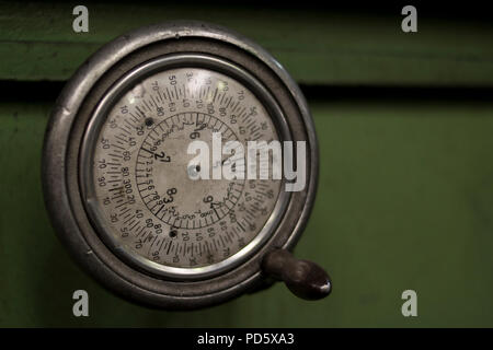 Old rustic classic green vintage retro mill machine part barometer scale clock cnc position on metal steel processing machine Stock Photo