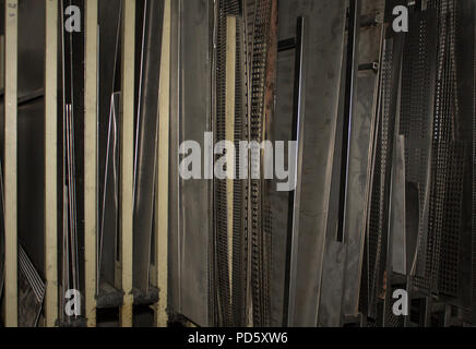 Sheet metal storage system in an old manufacturing factory work shop Stock Photo