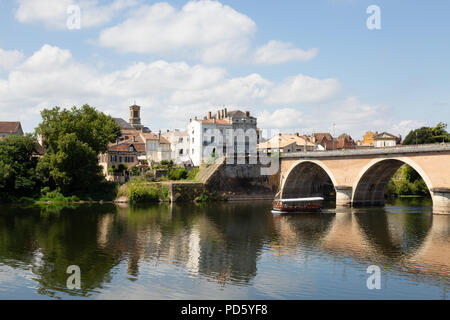 A tourist boat going under the old bridge;  the Dordogne River at Bergerac, Dordogne, France Europe on a sunny summer day in July Stock Photo