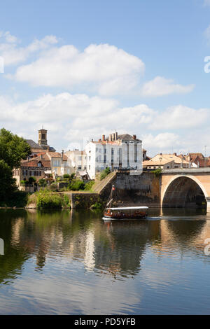 A tourist boat going under the old bridge;  the Dordogne River at Bergerac, Dordogne, France Europe on a sunny summer day in July Stock Photo